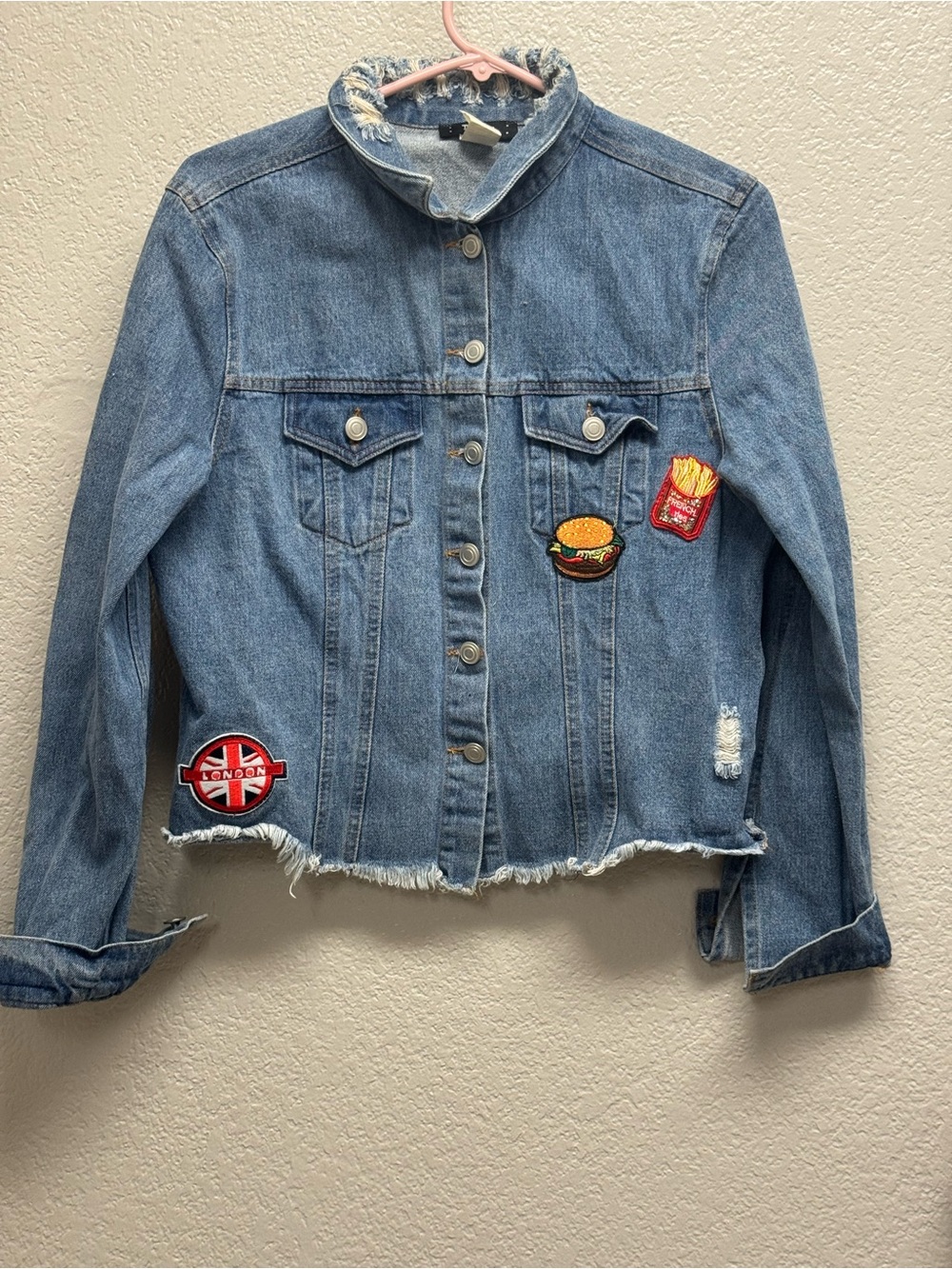 Toska Light Blue Denim Jacket with Fun Patch Accents Pit 19” L 21” woman’s M/L